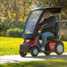 AFIKIM Red Afiscooter S4 Touring Mobility Scooter Solar Canopy With Rider Outdoor View