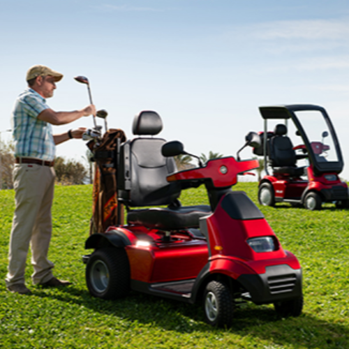 AFIKIM Red Afiscooter S4 Standard Mobility Scooter On Terrain View