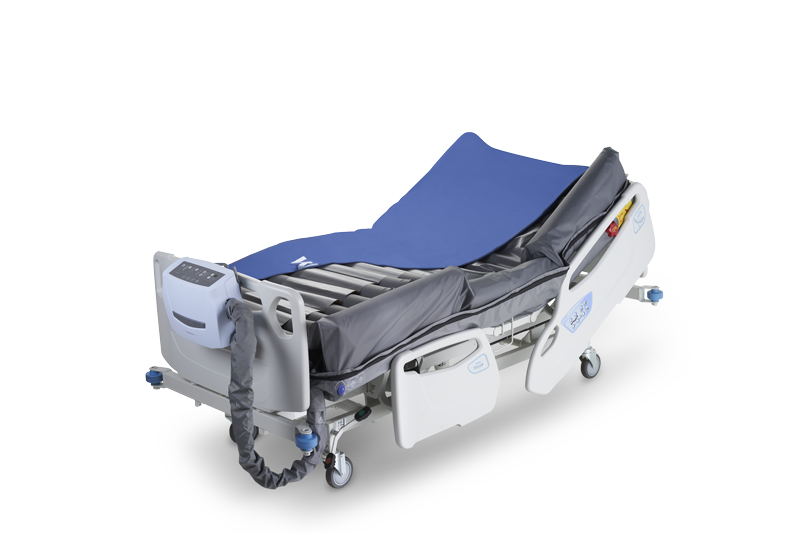 APEX Medical Wellell Optima Turn Lateral Rotation Pressure Relief Mattress In Bed Frame Half Covered With Air Cells And Air Pump View