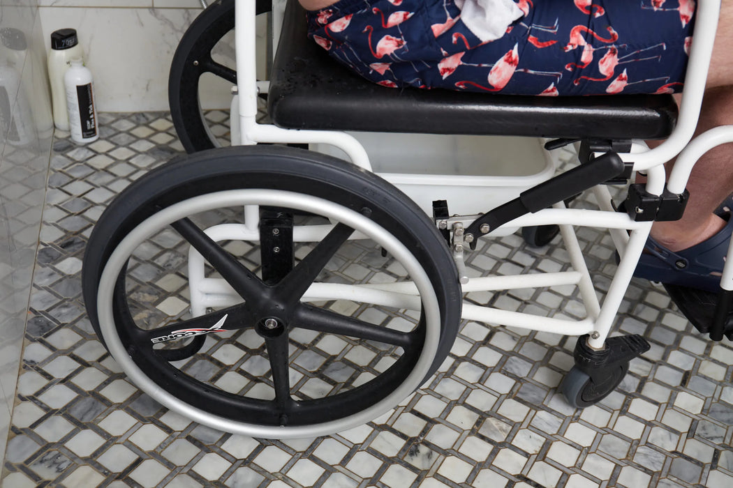Close Up Side View Of The High-Performance Wheels On The ActiveAid 600 Shower Chair Designed For Secure Locking And Smooth Maneuverability.