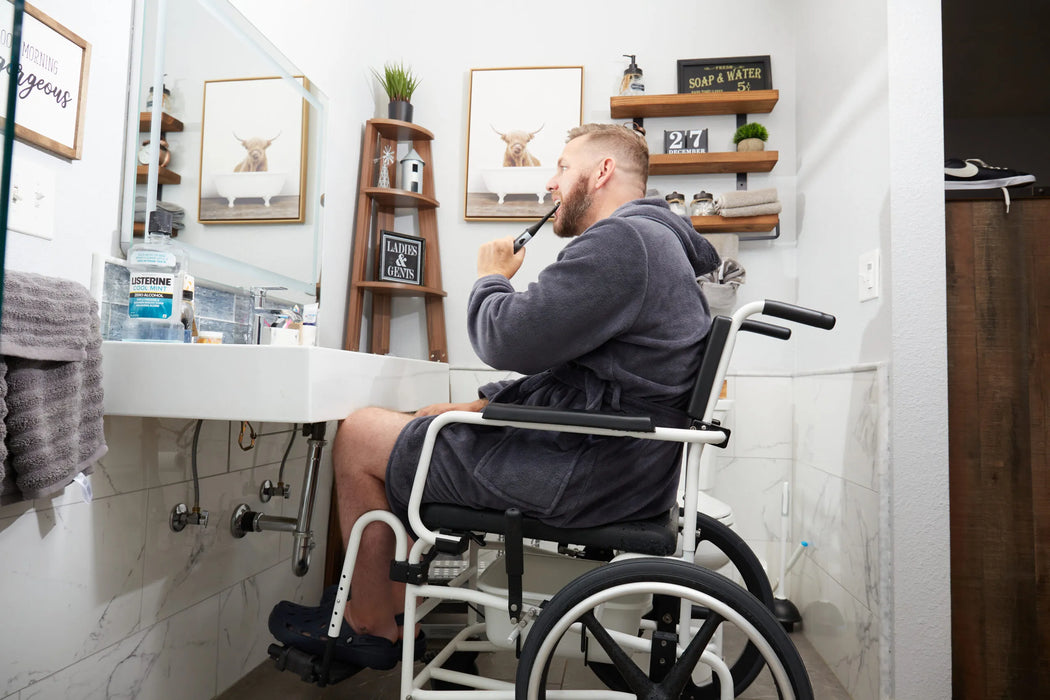 Side Profile Of An ActiveAid 600 Mobile Shower Chair Enabling User Independence And Mobility During Bathroom ADL Routines In A Home Setting.