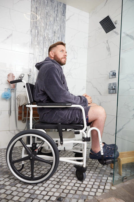 Altimate Medical ActiveAid 600 Stainless Steel Shower Chair In Use, Demonstrating Waterproof Rehab Commode Functionality In A Roll-In Shower.