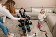 Altimate Medical EasyStand Bantam Small Stander Seated Position For Playing With Sister Pediatric Mobility Aid