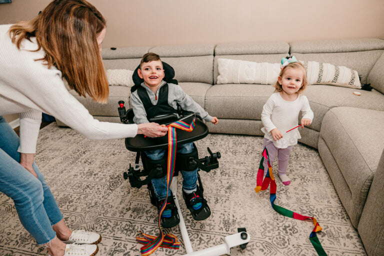 Altimate Medical EasyStand Bantam Small Stander Seated Position For Playing With Sister Pediatric Mobility Aid