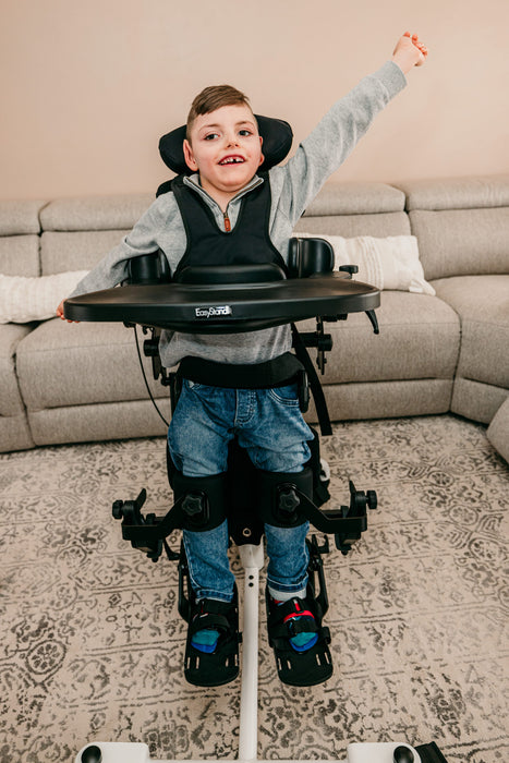 Altimate Medical EasyStand Bantam Small Stander With User Standing Independently Demonstrating Supported Upright Posture