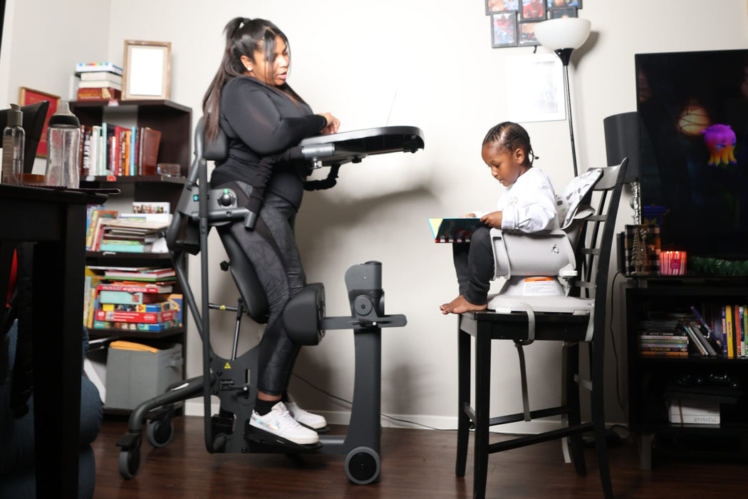 Altimate Medical EasyStand Evolv Large Stander Upright Position With User And Younger Brother Engaged In Reading Activity