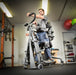 Altimate Medical EasyStand Glider Large Active Standing Frame for Mobility, Support & Full-Body Range of Motion Sample Photo with a Man Using it