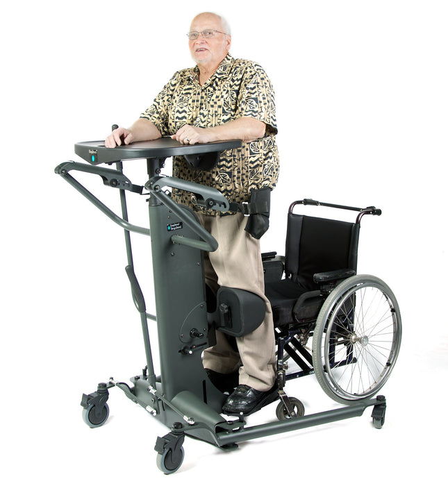 Altimate Medical EasyStand StrapStand No-Transfer Standing Frame With Innovative Vertical Lift Design with a Wheelchair on the side