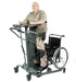 Altimate Medical EasyStand StrapStand No-Transfer Standing Frame With Innovative Vertical Lift Design with a Wheelchair on the side