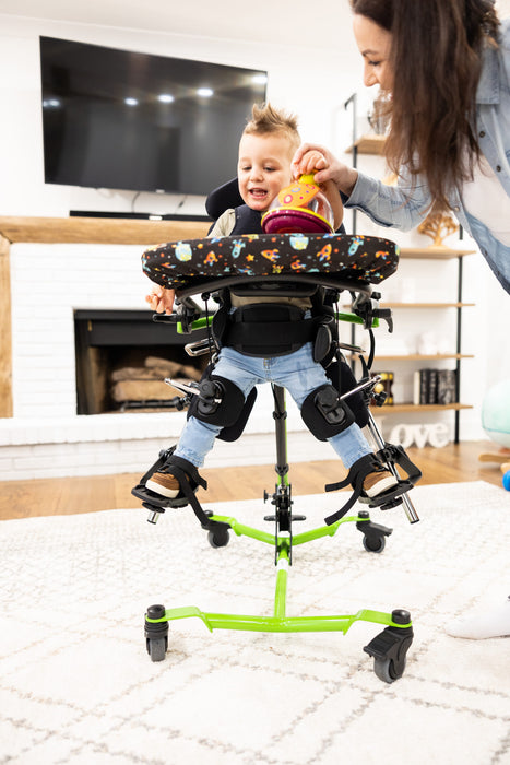 Altimate Medical Zing Supine Size 1 Pediatric Standing Frame Adjustable Supine-to-Vertical Positioning Playing in the Living Room