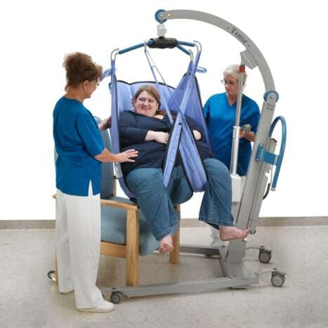 Arjo Bariatric Loop Comfort Sling In Use By Patient Assisted By Carer Front View