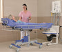 Arjo Concerto And Basic Shower Trolley With Patient And Caregiver Demonstrating Safe Head Support