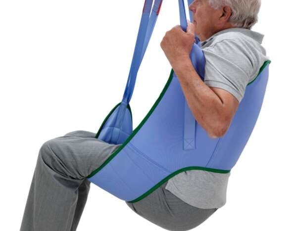 Close Up Side View Of Arjo Loop Sling Padded Legs Without Head Support In Use By Patient