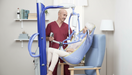 Arjo Maxi Move Patient Lift With Patient And Caregiver Chair Transfer Clip Sling View