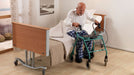 Arjo Minuet 2 Long Term Care Bed With Mattress Patient Getting Up From The Bed View