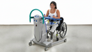 Arjo Sara Plus Walking And Mobility Sling In Use By A Patient Seated In A Wheelchair
