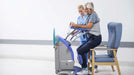 Arjo Sara Plus Wipeable Standing Sling Assisting Patient Chair Transfer With Caregiver