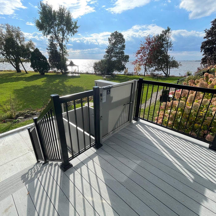 Upper Landing Safety Gate And Operating Controls Of The Atlas VISTA Vertical Platform Lift.