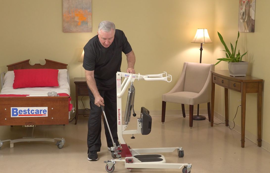 Bestcare BestStand SA228 Sit-to-Stand Patient Lift With Caregiver Holding Lever
