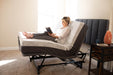 Flex A Bed Hi Low Adjustable Bed Queen Size In Fully Raised Head And Knee Section With Headboard And User In The Bed Side View