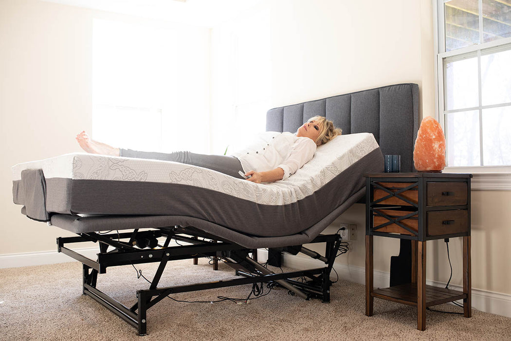 Flex A Bed Hi Low Adjustable Bed Queen Size In Raised Head And Knee Section With Headboard And User In The Bed Side View