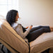 Flex A Bed Value Flex Base Frame In Raised Head And Partially Knee Section With Patient Holding Hand Control Closer View