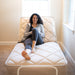Flex-A-Bed Value Flex Base Frame In Raised Head Section With Patient Holding Wired Remote Control Front View