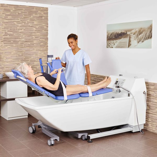 Handicare AVERO Premium Plus Bathtub Featuring Height-Adjustable, Wheelchair Accessible Care Bathtub And Universal Bath Lift Compatibility With Lift Being Used
