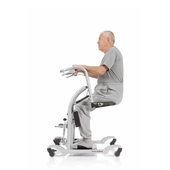 Handicare QuickMove Sit-to-Stand Aid For Patient Transfers With Up To 375 Lb Capacity Featuring Patient Sitting On Lift
