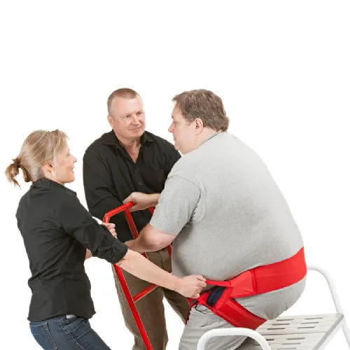 Handicare ReTurn 7600 Sit-to-Stand Patient Lift 450 lb Capacity Transfer Device For Bariatric Support With Patient Using Lift Assisted By Caregivers