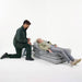 Joerns Mangar Camel Lifting Cushion With Patient Lying Down Assisted By Caregiver And Airflo 24 Decompressor View