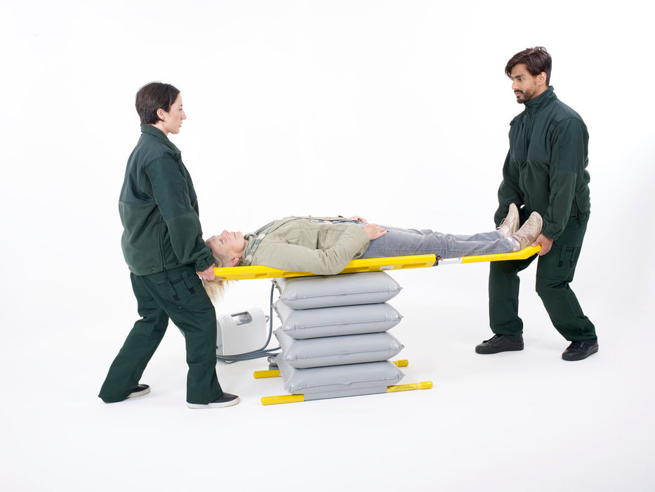 Joerns Mangar Elk Lifting Cushion With Patient In Stretcher Assisted By Caregiver And Airflo 24 Decompressor View