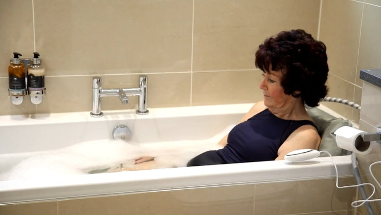 Joerns Mangar Inflatable Bathing Cushion with Airflo 12 With User Inside Bathtub View