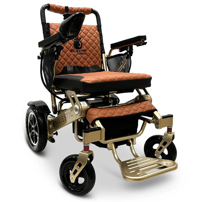 Bronze Frame and Taba Textile ComfyGO MAJESTIC IQ-7000 Auto Folding Electric Wheelchair Lightweight, Airline-Friendly, and Travel Ready with premium quilted taba seat and backrest with gold stitching and joystick controller is mounted on the right armrest