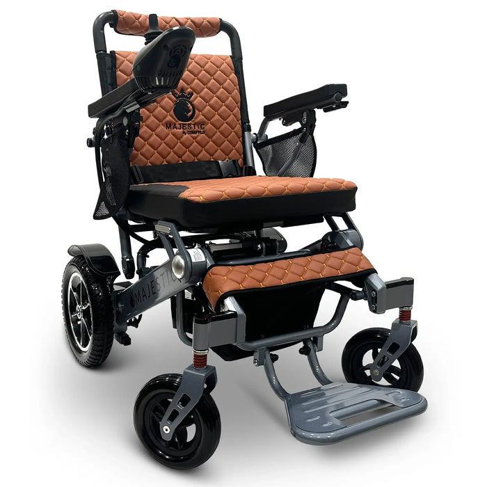 Silver Frame Taba Textile ComfyGO MAJESTIC IQ-7000 Auto Folding Electric Wheelchair Lightweight, Airline-Friendly, and Travel Ready with premium quilted taba seat and backrest with gold stitching and joystick controller is mounted on the right armrest