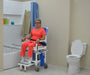 MJM International All Purpose Dual Shower Transfer Chair In Bathroom Setting With Patient Beside Bathtub View