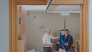 Mackworth TX600 Fixed Ceiling Track Lift With Patient In Lift View