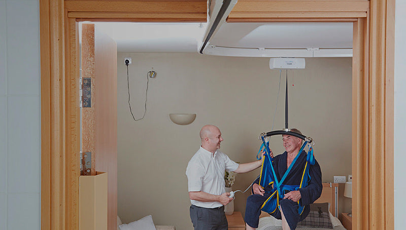 Mackworth TX600 Fixed Ceiling Track Lift With Patient In Lift View