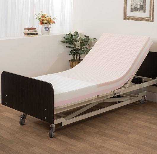 Medacure Proex Pressure Redistribution Mattress with Memory Foam No Cover In A Bed Frame Elevated Head Section Bedroom View