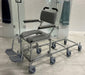 Nuprodx MC6000RS Commode Chair With Shower Access Slider System Padded Backrest Flip Up Armrest Cushion Seat Swing Away Footrest With Derlin Caster Wheels And Shower Access Slider System View
