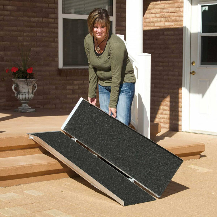 PVI Singlefold Ramp Outside Doorway With Person Folding Ramp View