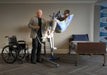 Proactive Medical Protekt® All-In-One Folding Electric Patient Lift With Patient And Caregiver  In Fully Raised Position View