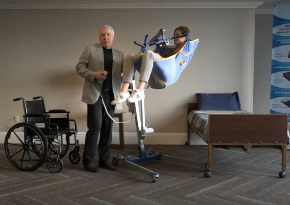 Proactive Medical Protekt® All-In-One Folding Electric Patient Lift With Patient And Caregiver  In Fully Raised Position View