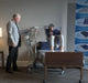 Proactive Medical Protekt® All-In-One Folding Electric Patient Lift With Patient And Caregiver In Bed Transfer View