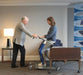 Proactive Medical Protekt® Dash Sit to Stand Lift With Patient And Caregiver In Bed Transfer View