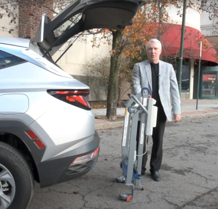 Proactive Medical Protekt® Take-A-Long Folding Electric Patient Lift With Caregiver Ready To Load Folded Lift In Car Trunk View