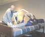 Proactive Medical Protekt® Transformer Hydraulic Patient Lift With Patient And Caregiver In Bed Transfer View