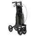 Rollz Air Carbon Rollator In Coal Black Folded Completely and Standing In An Upright Position.