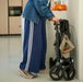 Rollz Flow Aluminum Walker In Granite Black Demonstrating The Easy Folding Mechanism.