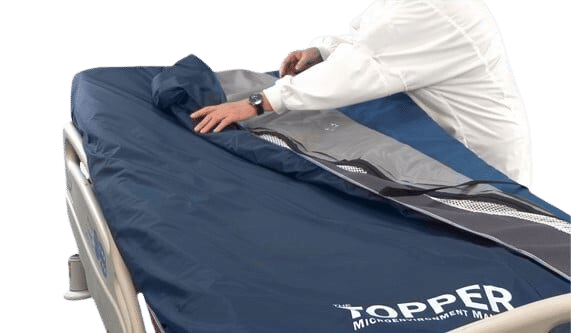 SPAN America Topper MicroEnvironment Manager Airflow Mattress Overlay For Moisture And Heat Control With Person Showing How To Put The Cover On And Off